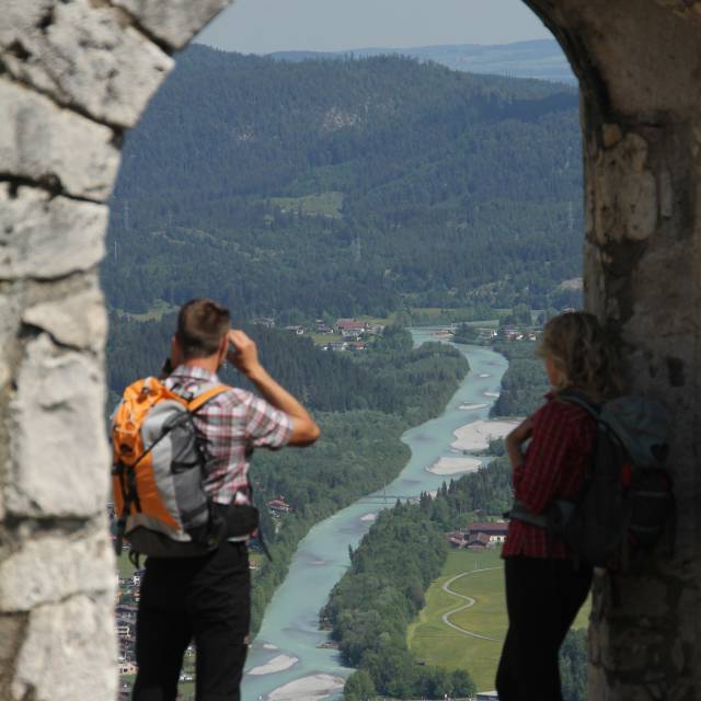 A couple enjoys the view from Ehrenberg Castle over the Wilffluss Lech river